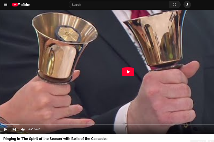 Hands holding handbells on KOIN AM Extra broadcast in Portland