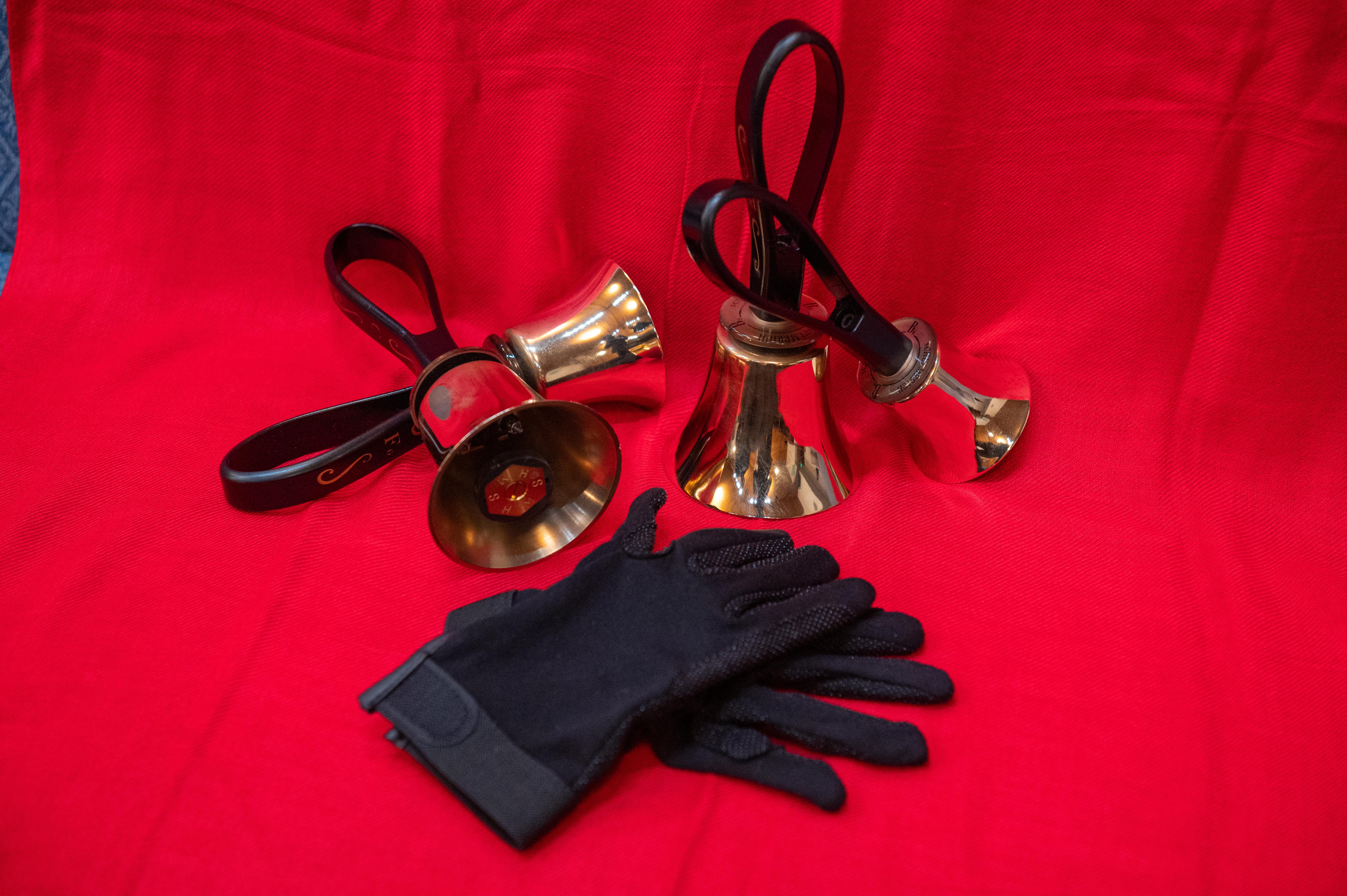 Bells and gloves on a red backdrop