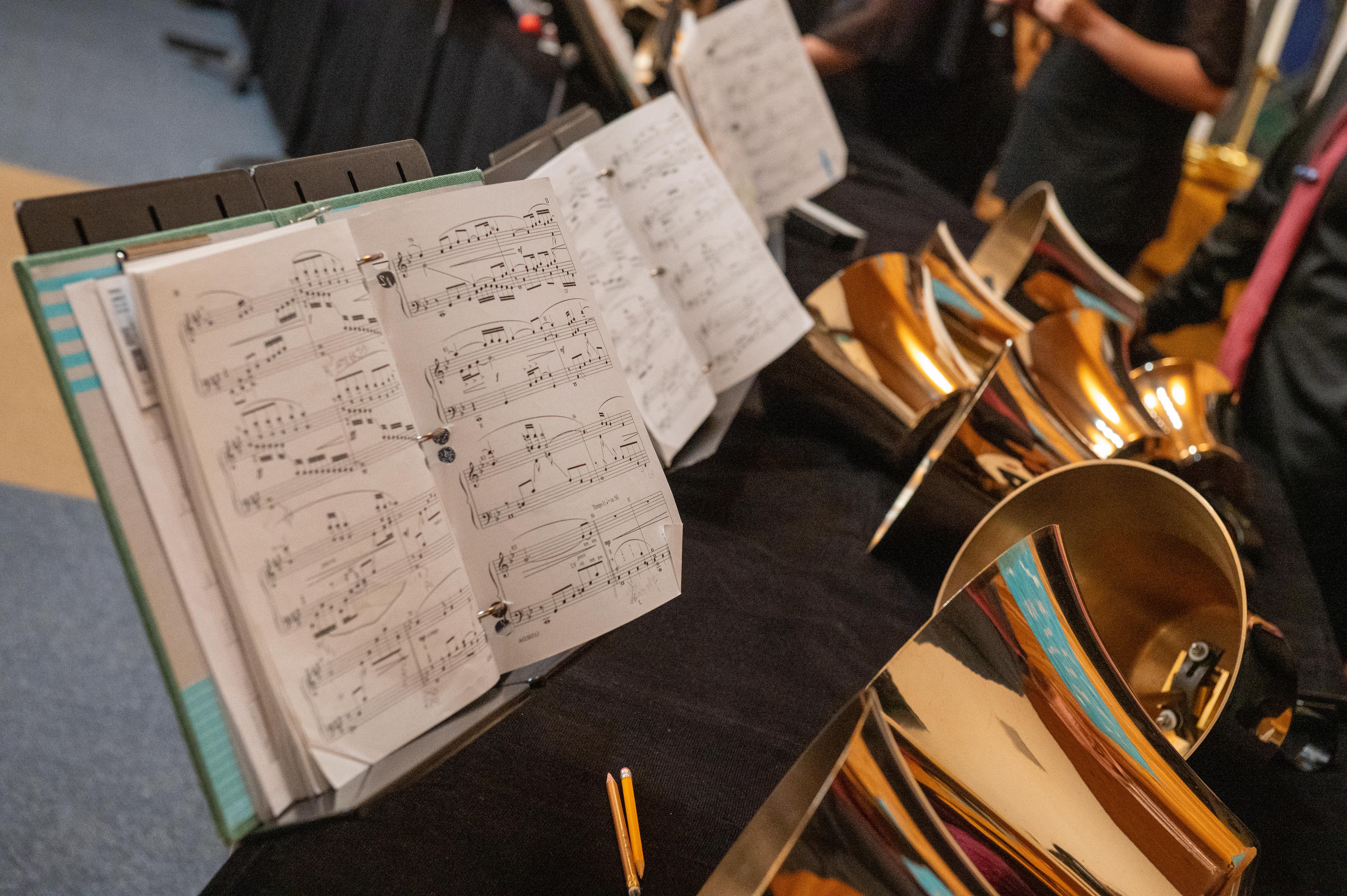 Bass handbells in concert with ringers reading music